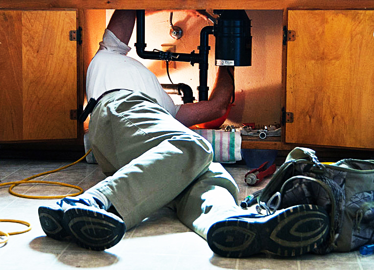 plumber under sink