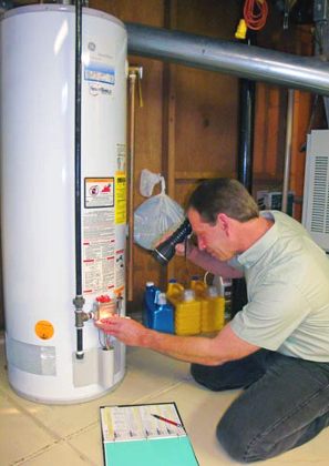 Boulder plumbing team member repairs water heater